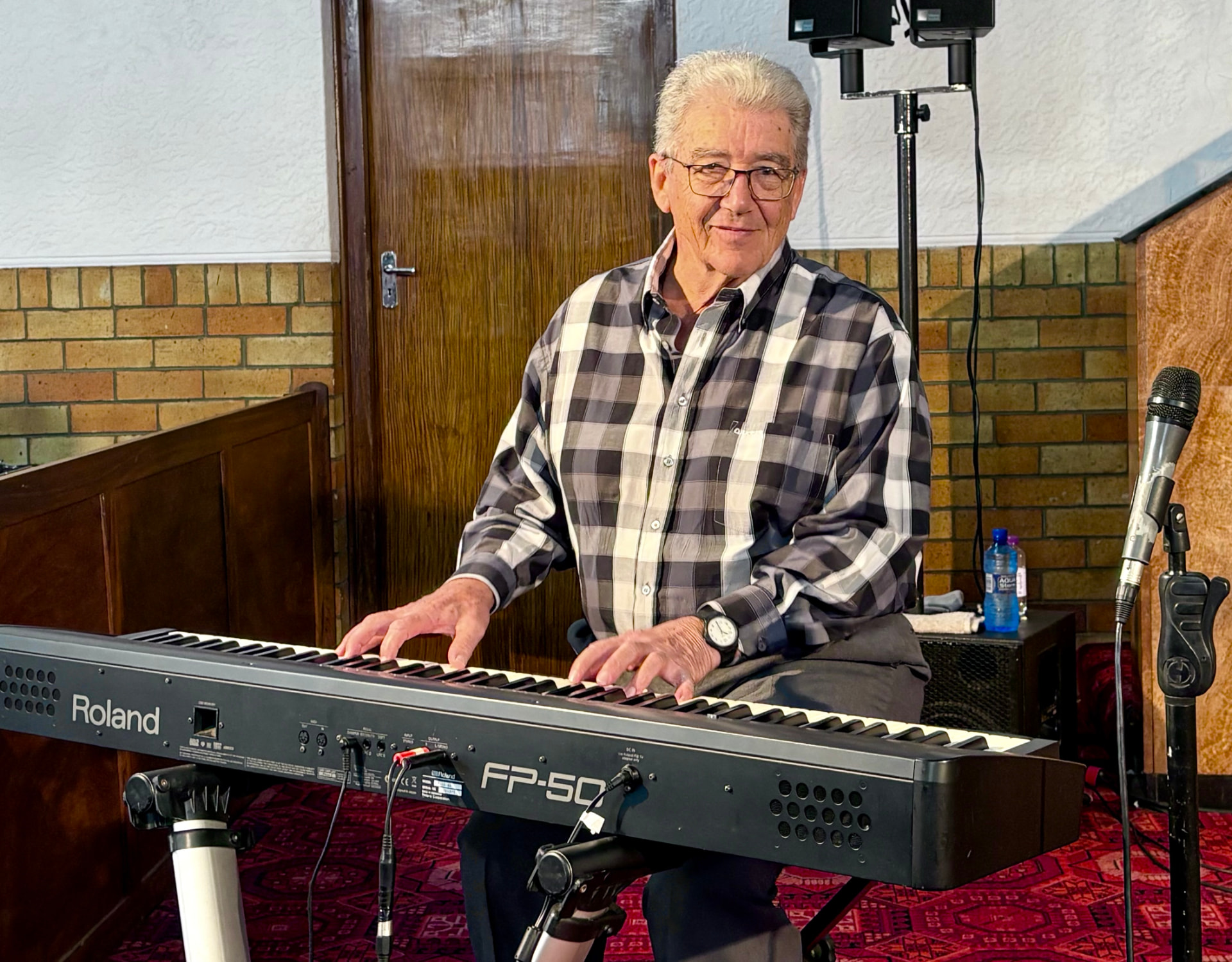 A CSO Faith Ambassador playing the keyboard