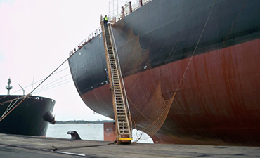 A seafarer receiving a Bible on board a vessel